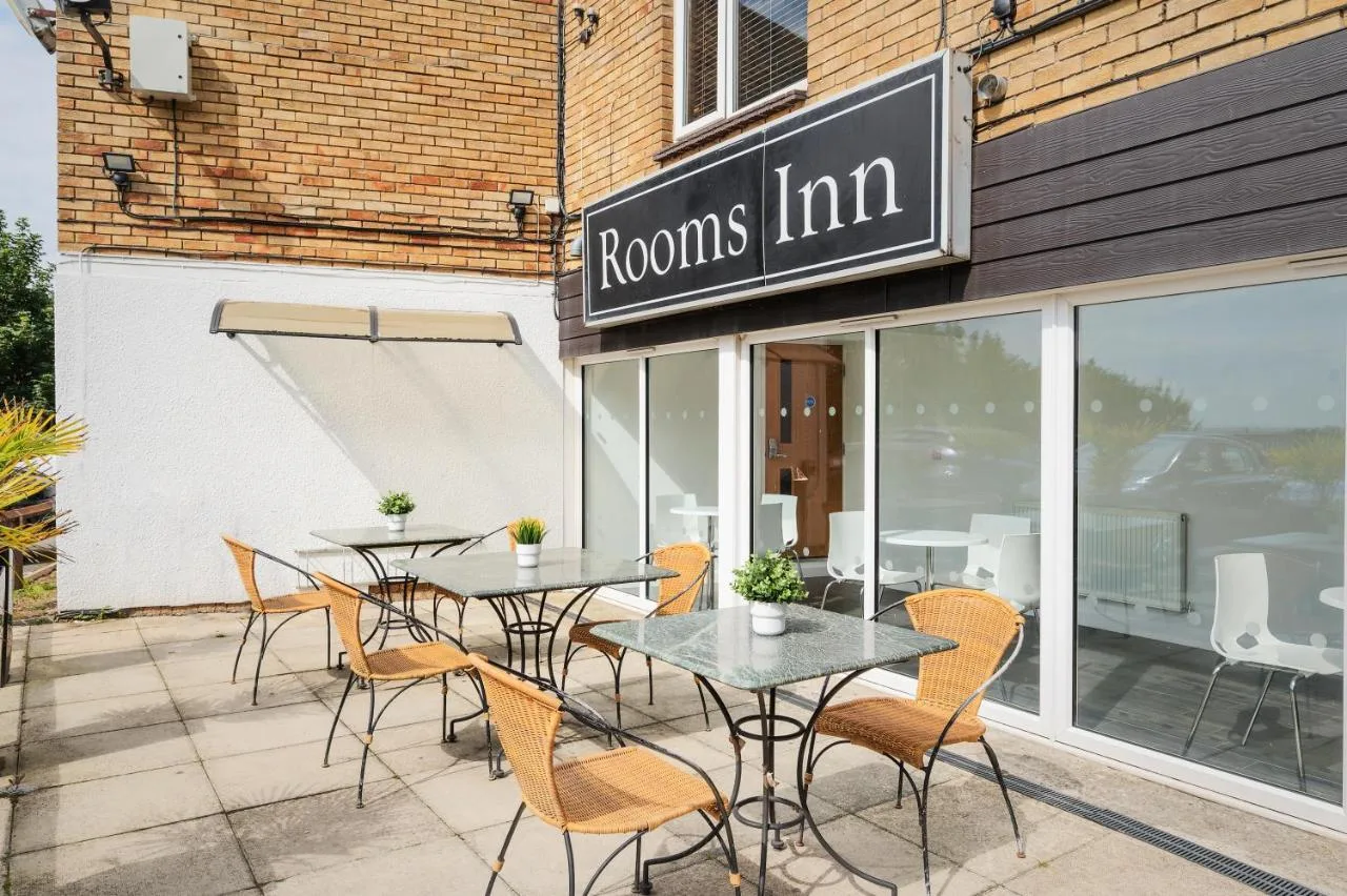 a group of tables and chairs outside of a restaurant at Rooms Inn, Newcastle upon Tyne